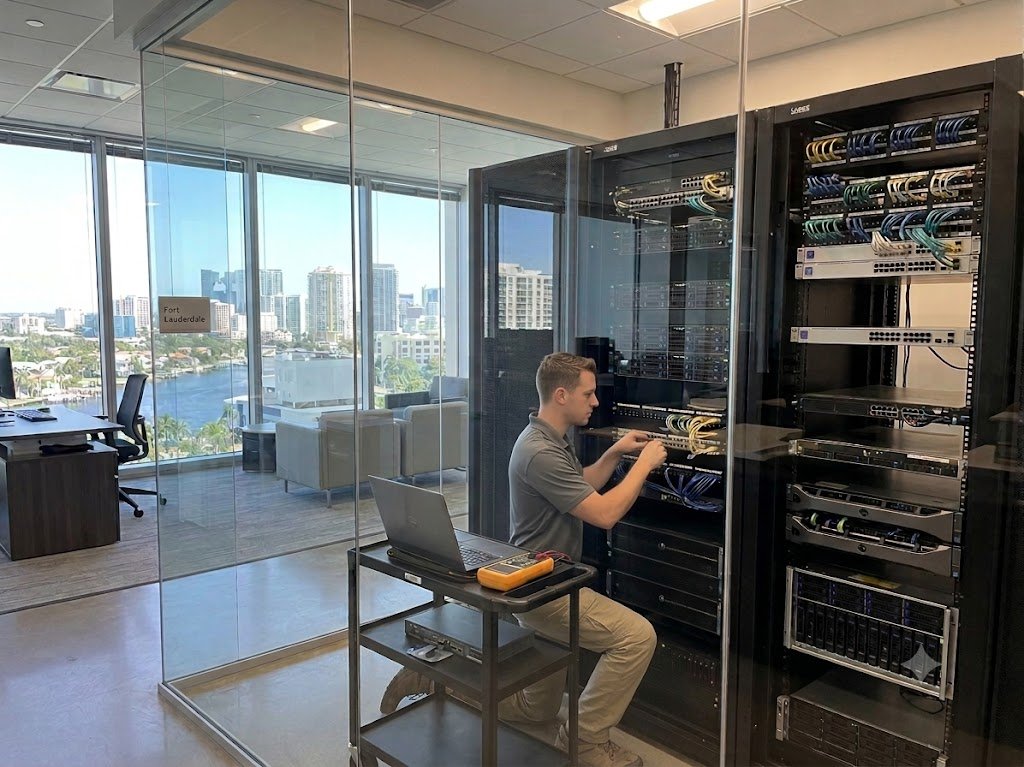 IT professional providing network support in a Fort Lauderdale business office.